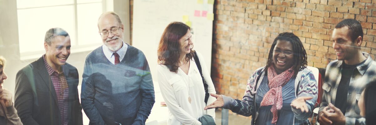 Group of people talking and smiling