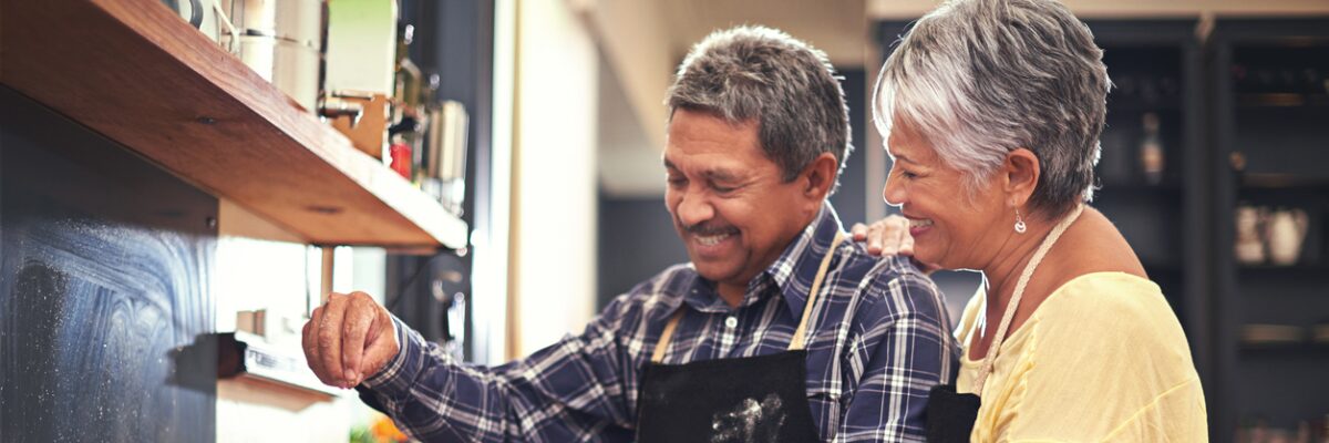 Retired couple enjoying cooking together