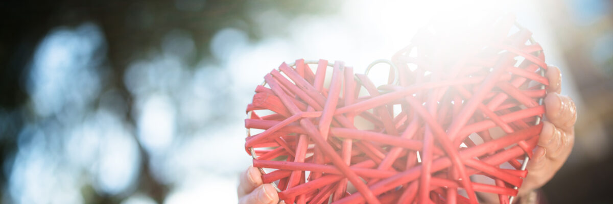 Person holding a string heart