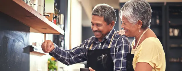 Retired couple enjoying cooking together
