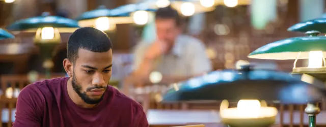 student in library studying