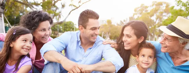 Extended family sitting in yard